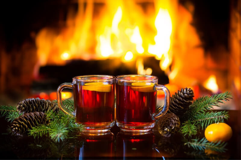 hot drinks in front of a fireplace