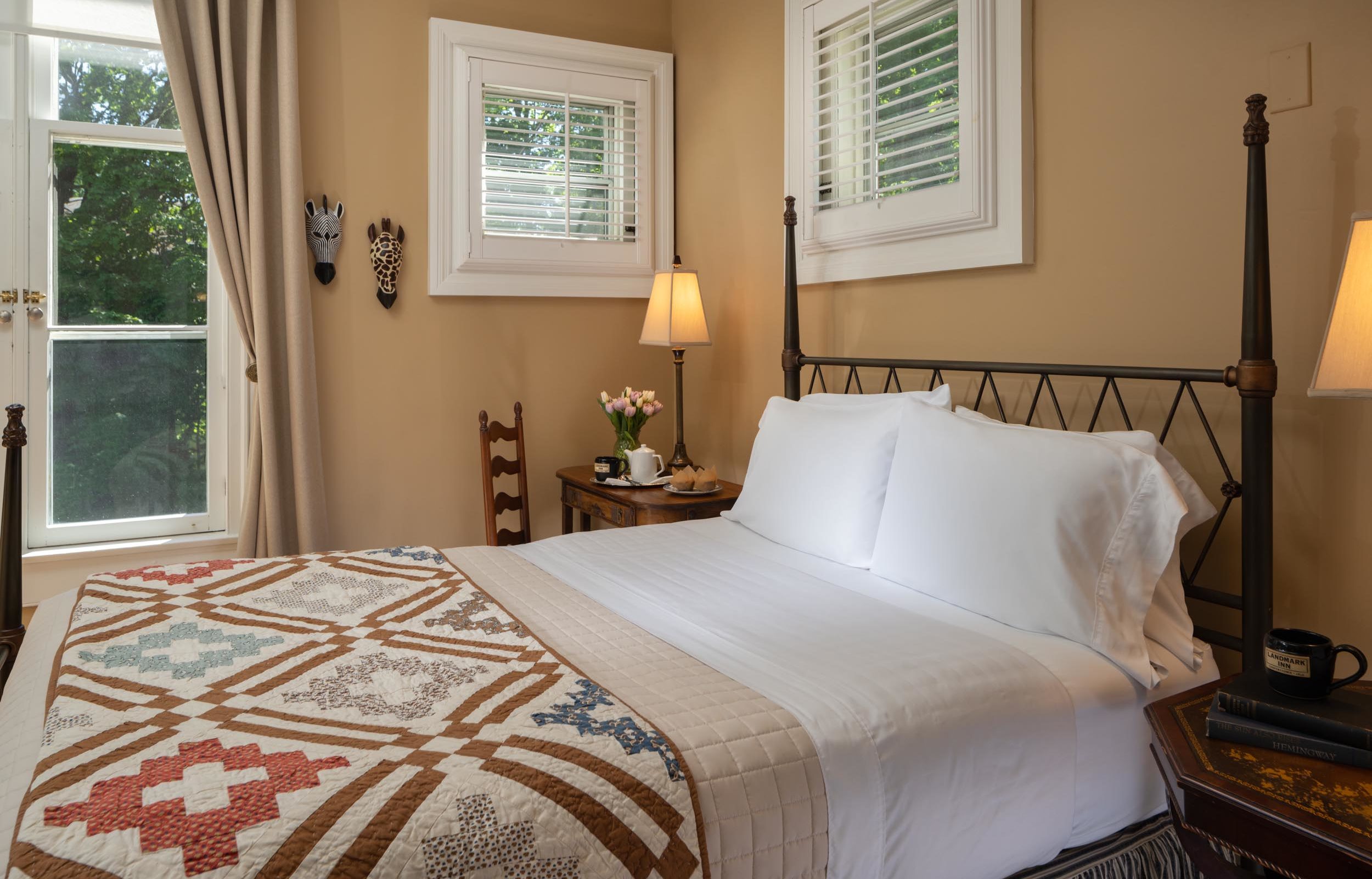 Plush bed with iron-frame headboard