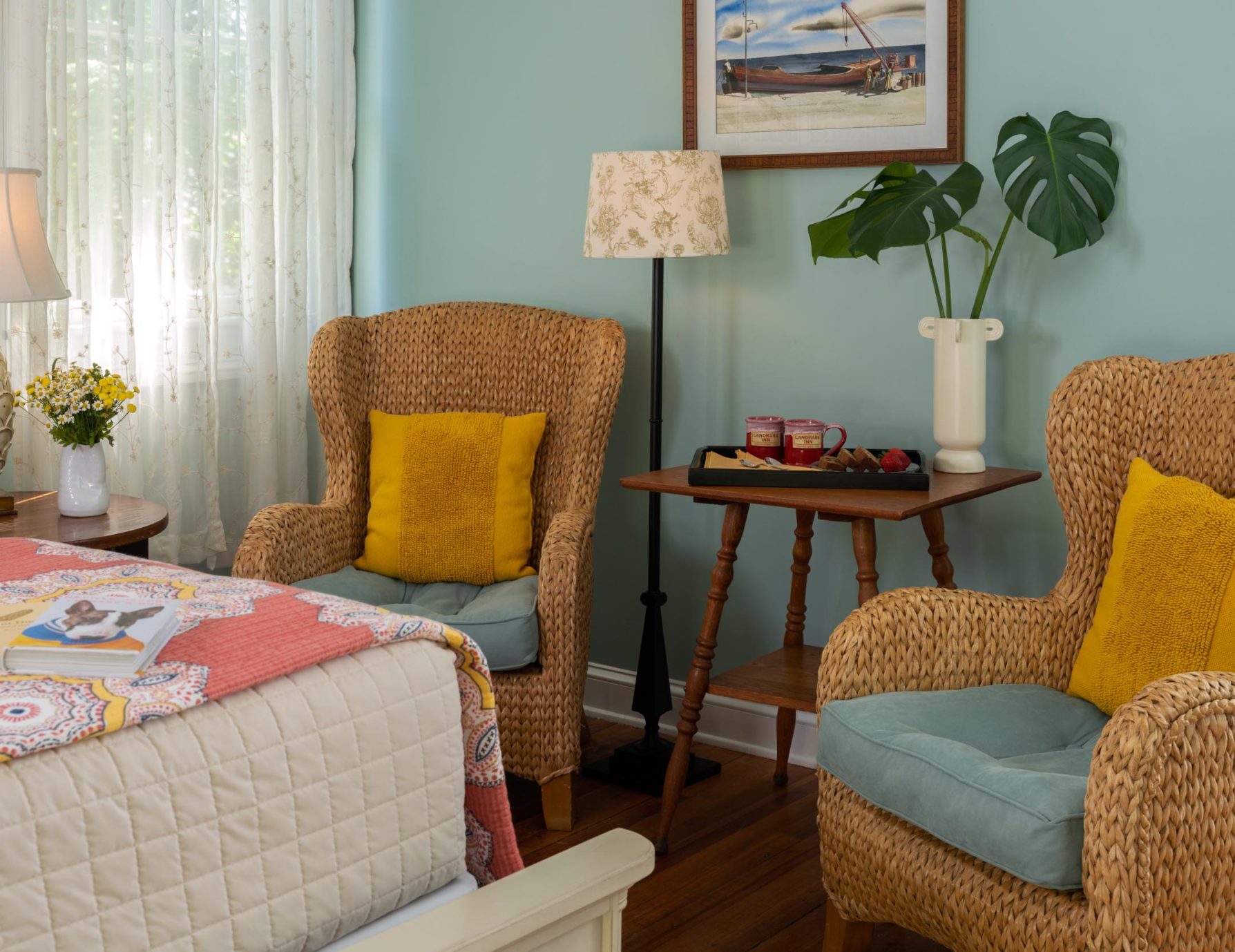 Sitting area by bed at a Cooperstown Boutique Hotel