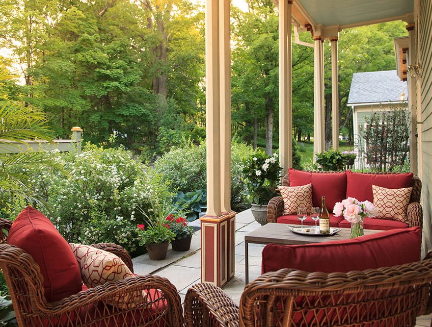 Sitting area outside the Landmark Inn with verdant plants nearby