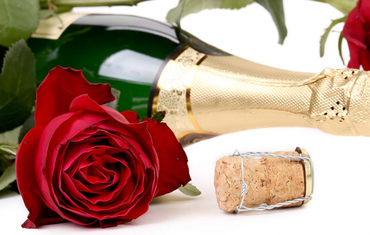 Bottle of Champagne with Red Rose