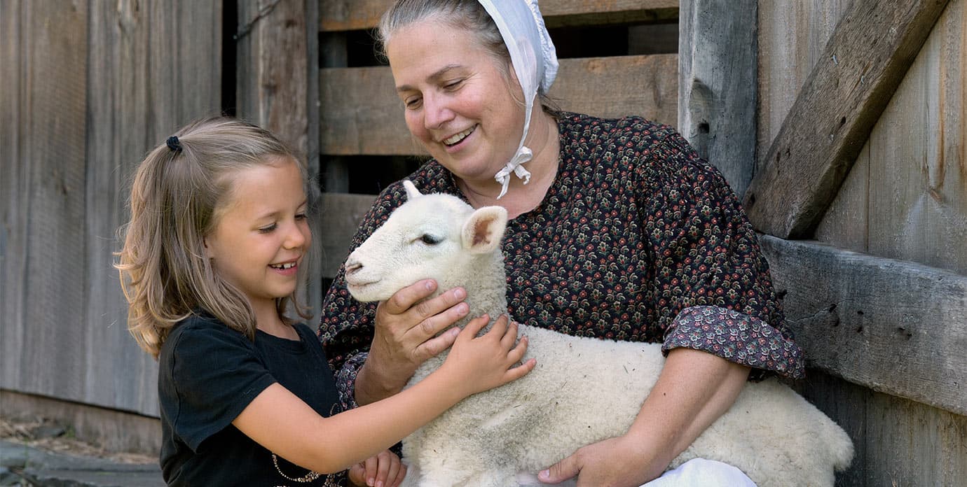 Child seeing animal at Farmers' Museum in Cooperstown