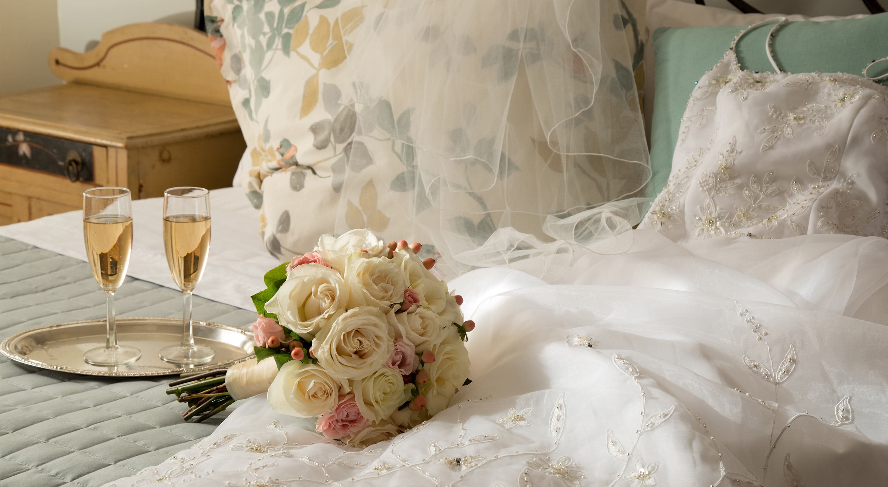 wedding dress and bouquet with Champagne at a Cooperstown NY Inn